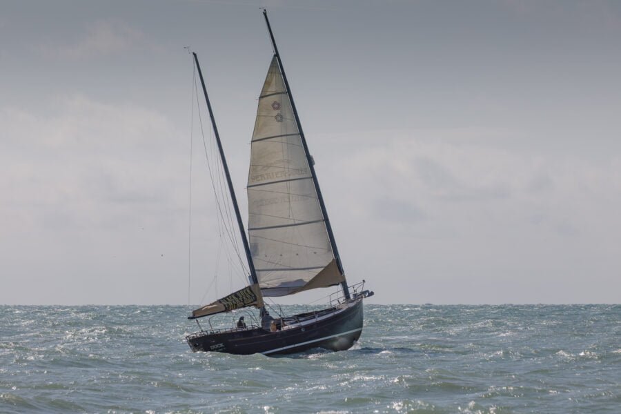 Sailboat Riding Rough Surf In Gulf Of Mexico