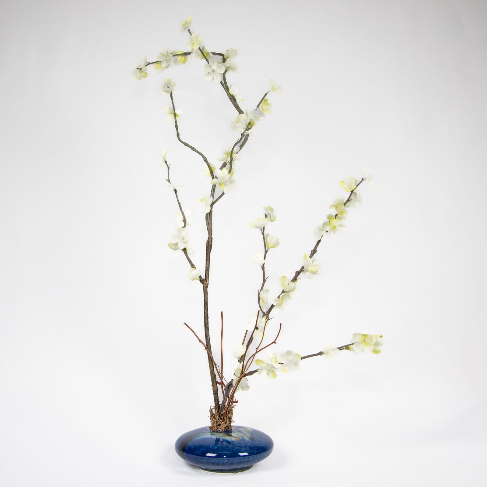Small Round Blue Vase With White Flowers