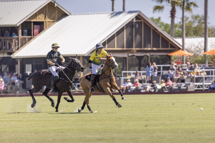 Two Polo Players Chasing Ball