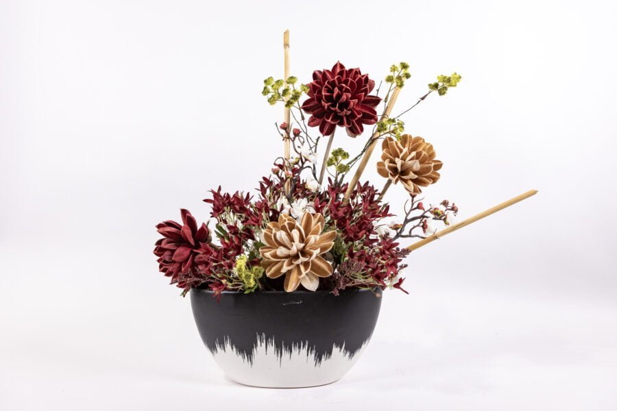 Black And White Vase With Deep Red And Copper Colored Flowers