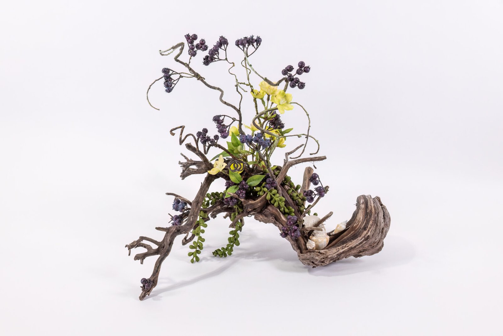 Driftwood With Yellow Flowers And Purple Berries