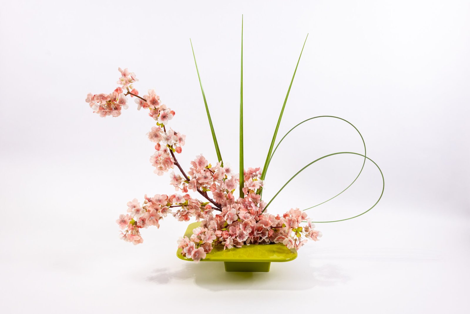 Square Olive Vase With Pink Flowers And Grass Blades