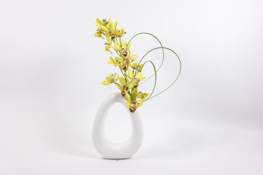 White Oval Vase With Yellow Flowers And Grass Blades