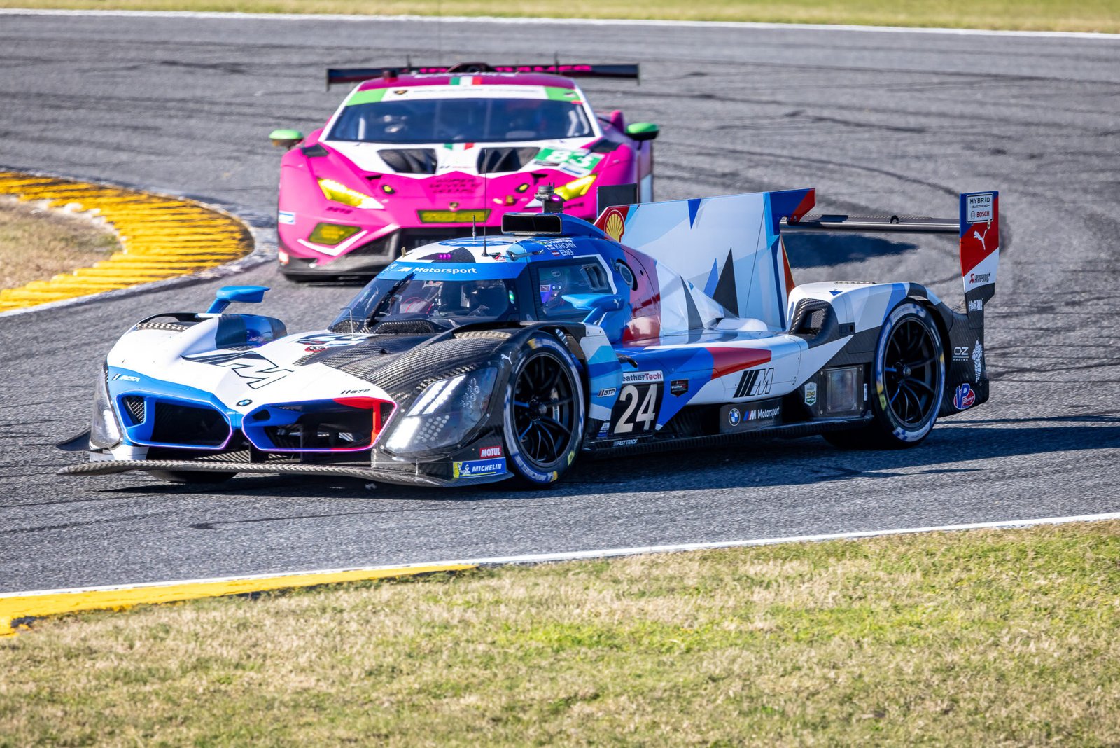24 Team Rll Bmw Exiting International Horseshoe At Daytona International Speedway 2024