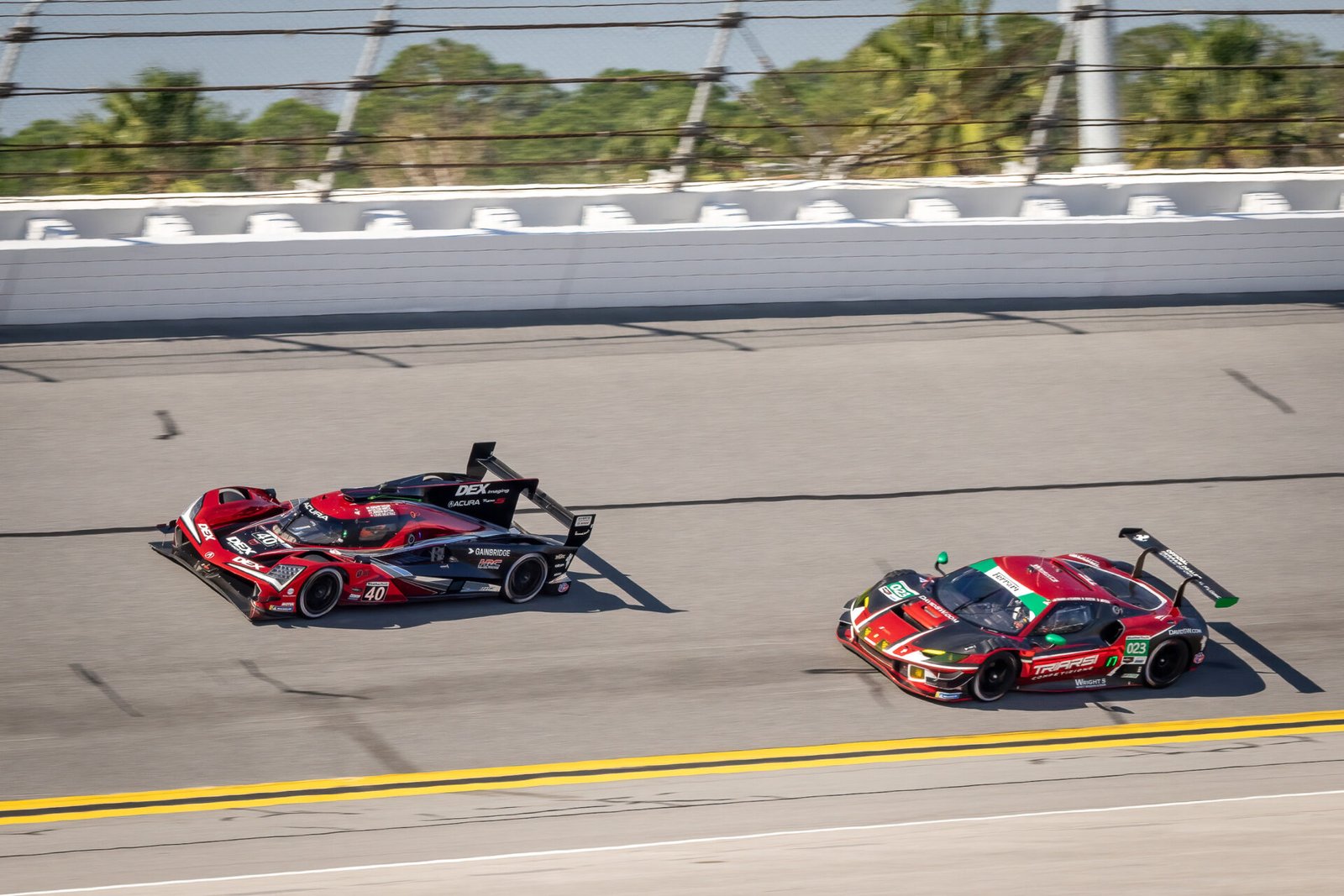 40 Wayne Taylor Andretti Racing Acura And 023 Triarsi Ferrari In Turn 1 At Daytona International Speedway 2024