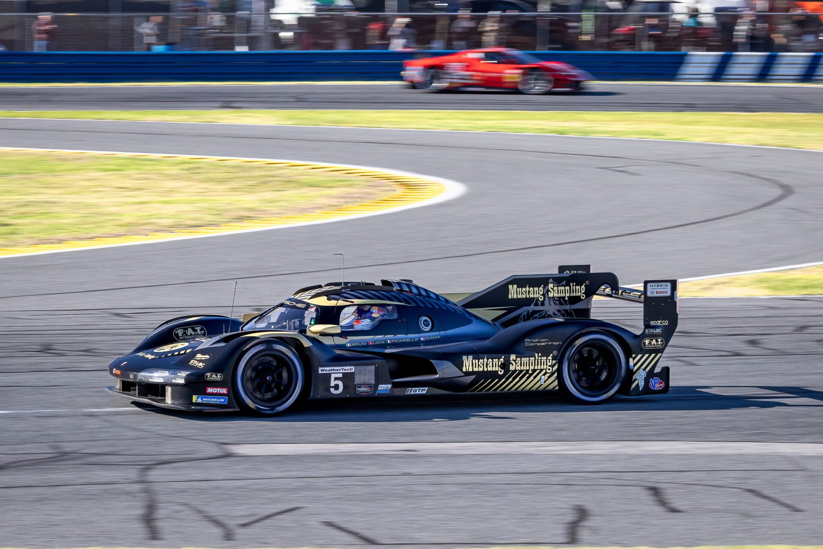 5 Proton Competition Porsche Exiting International Horseshoe At Daytona International Speedway 2024