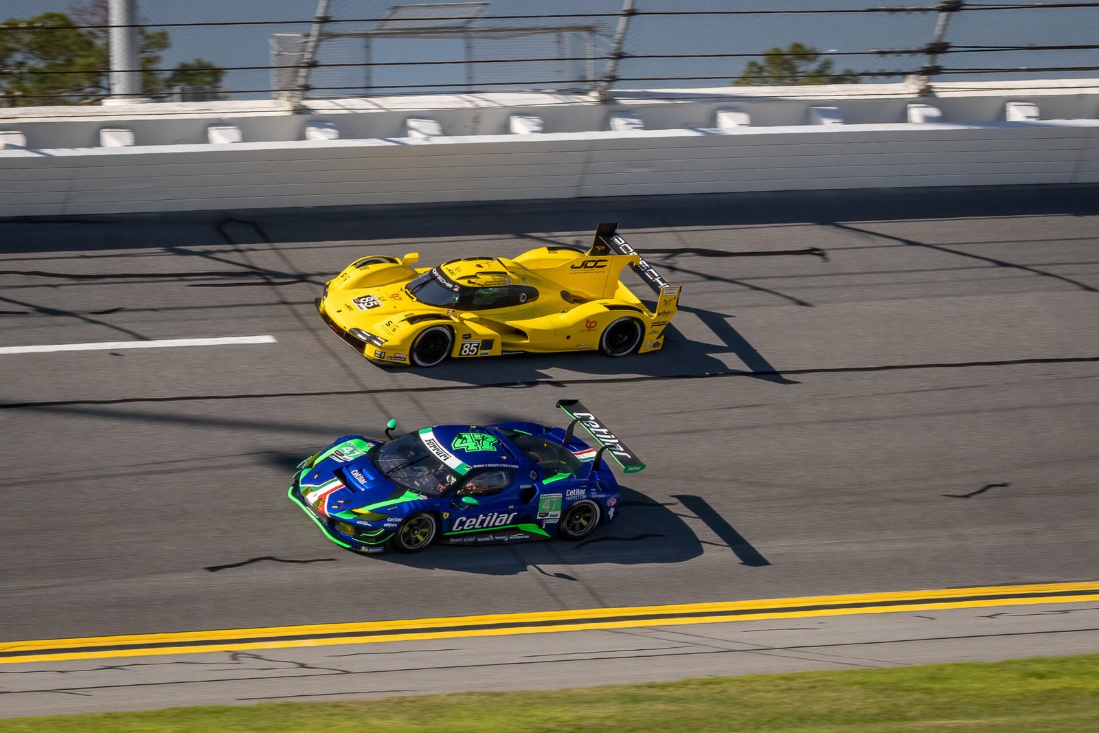 85 Jdc Miller Motorsports Porsche And 47 Cetilar Racing Ferrari In Turn 1 At Daytona International Speedway 2024
