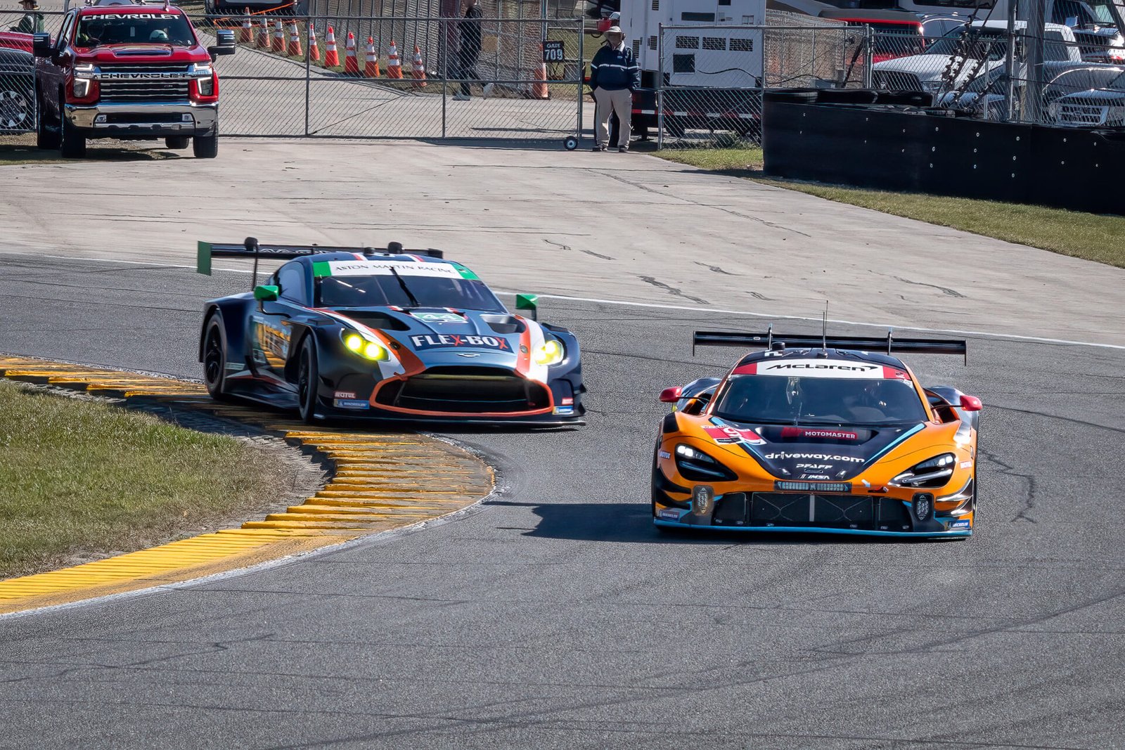 9 Pfaff Motorsports Mclaren And 44 Magnus Racing Aston Martin Through West Horseshoe At Daytona International Speedway 2024