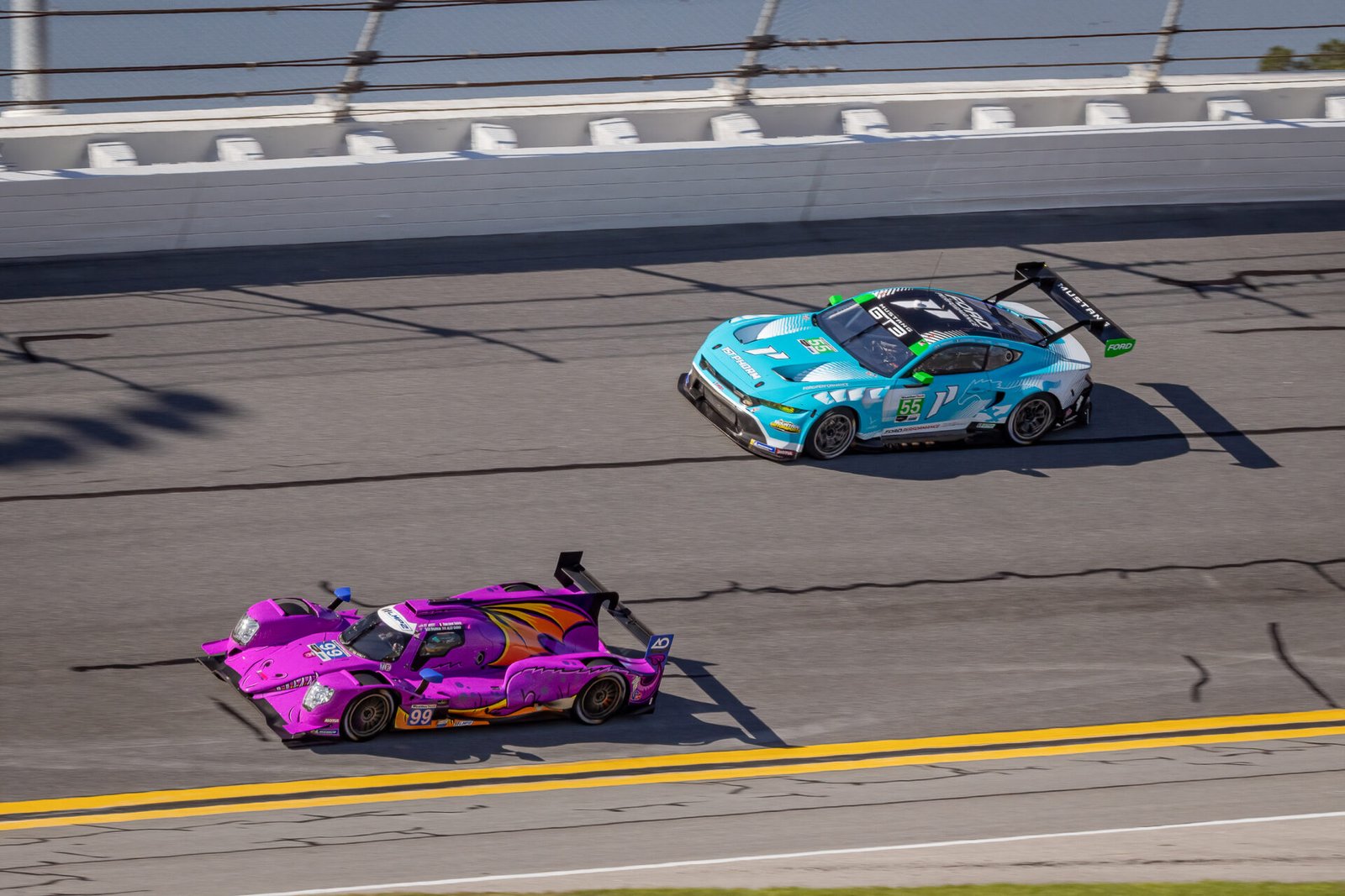 99 Ao Racing Oreca And 55 Proton Competition Mustang In Turn 1 At Daytona International Speedway 2024