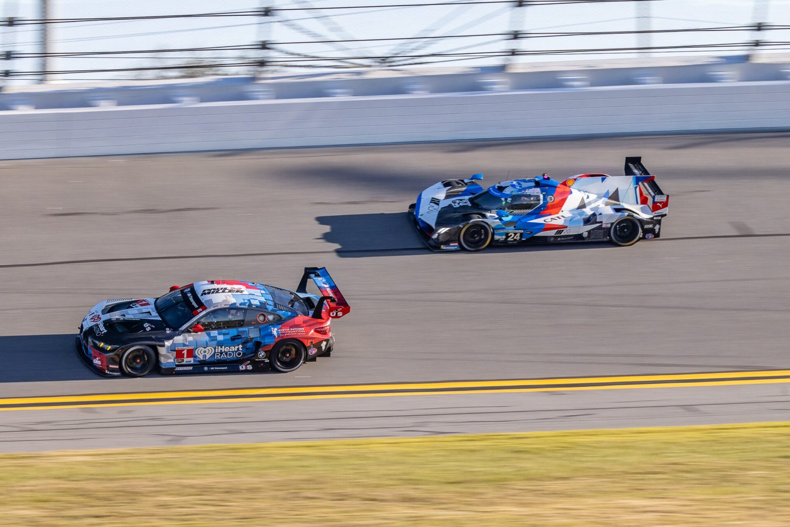 1 Paul Miller Racing Bmw And 24 M Team Rll Bmw On Turn 1 Banking At Daytona International Speedway 2025
