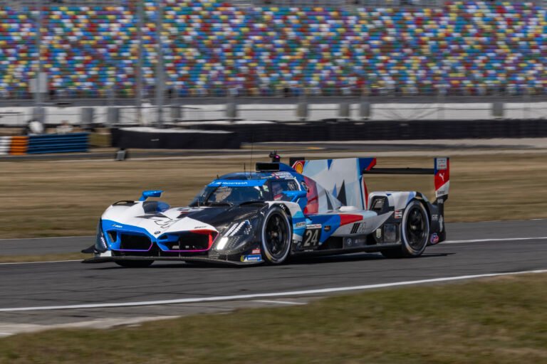 24 M Team Rll Bmw Entering West Horseshoe At Daytona Internation