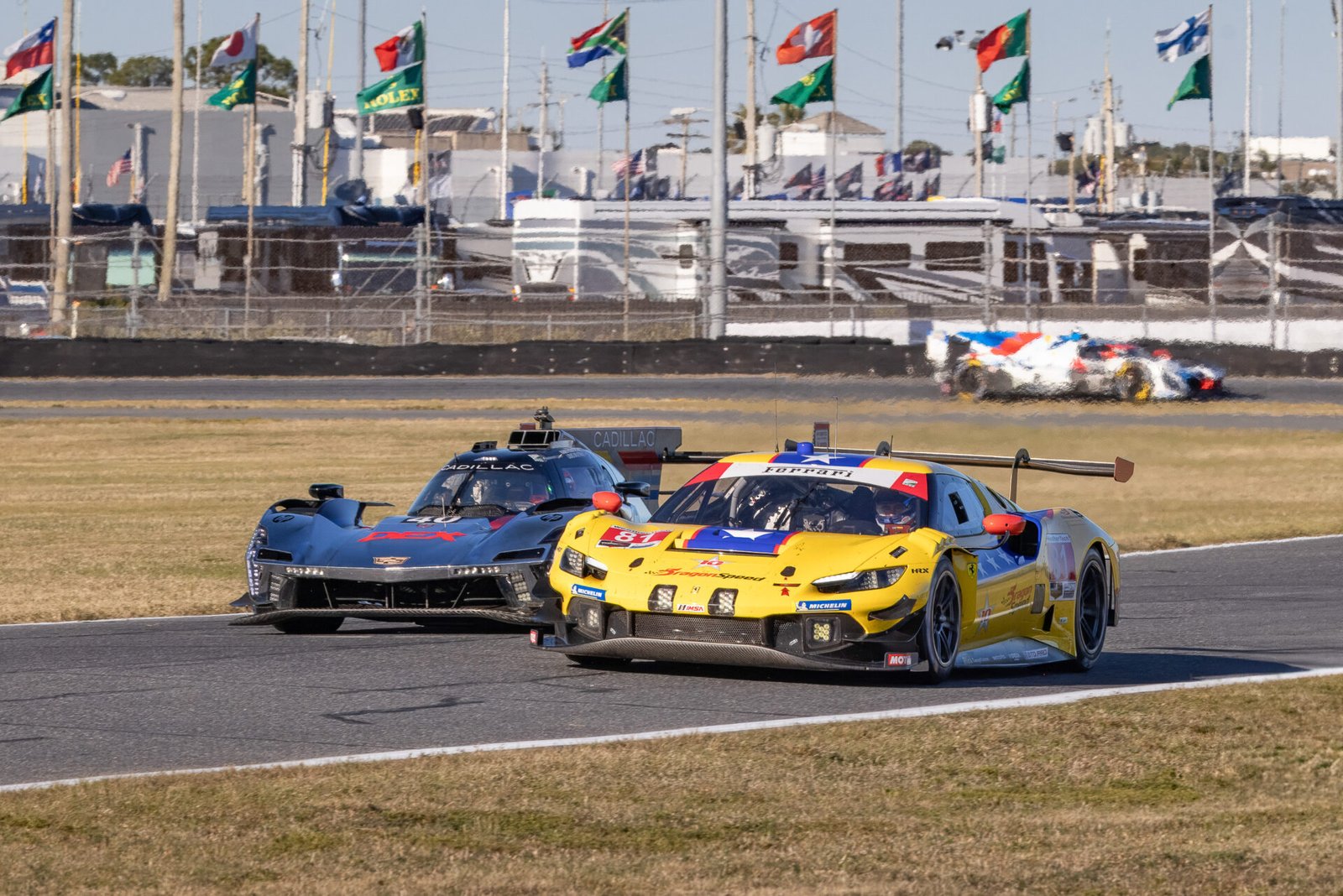 81 Dragonspeed Ferrari And 40 Wayne Taylor Racing Cadillac Heading Toward West Horseshoe Horseshoe At Daytona International Speedway 2025