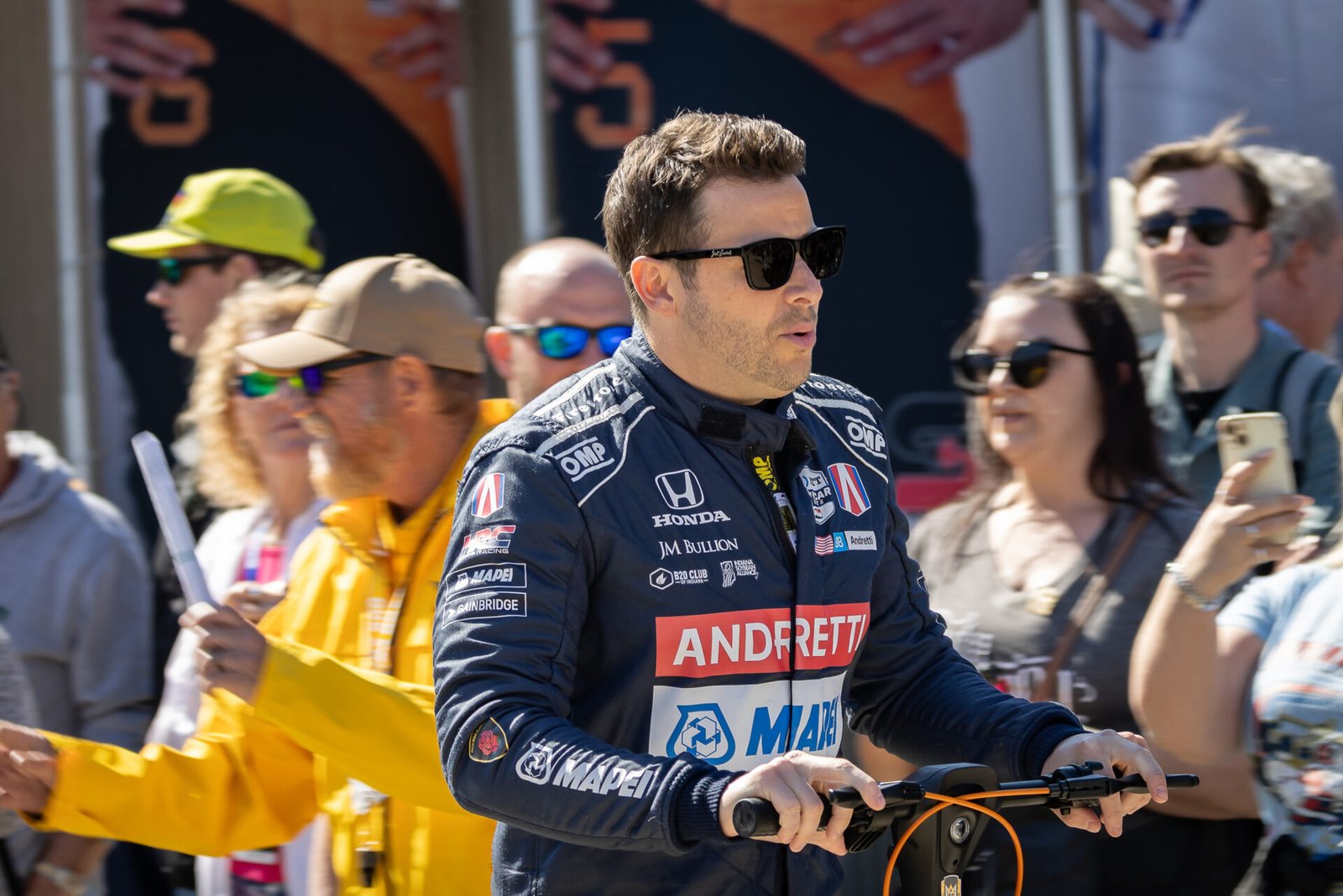 Marco Andretti Rides Through Gasoline Alley