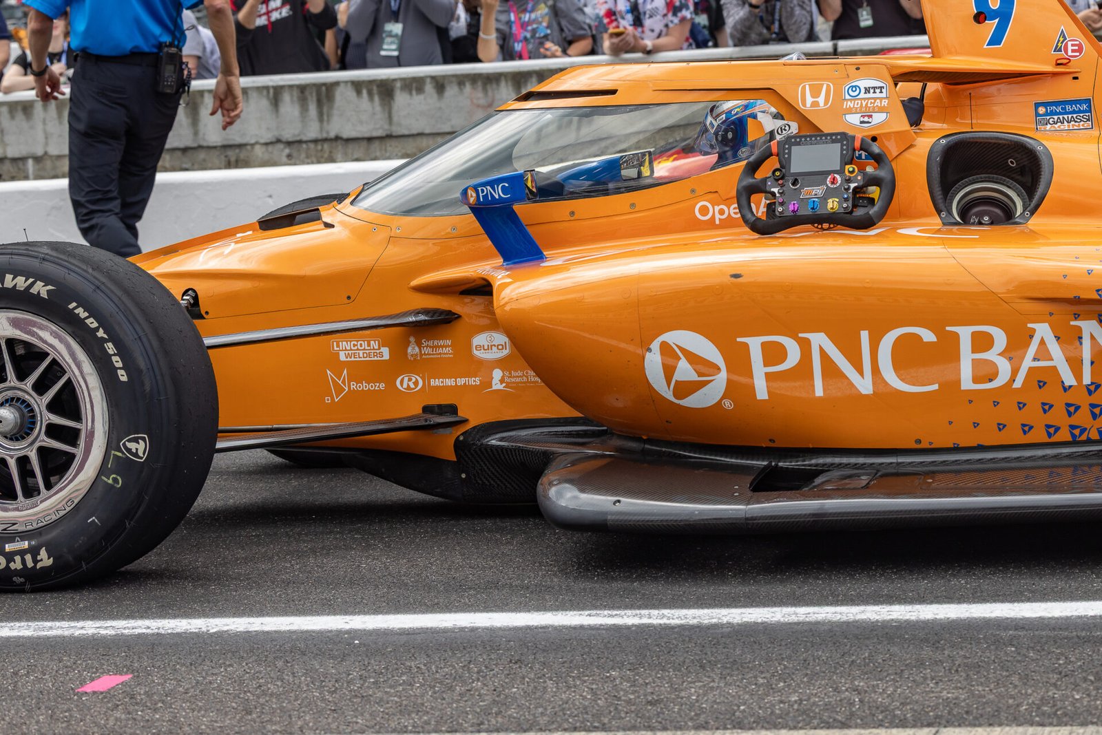 Scott Dixon Rests Steering Wheel Outside Car