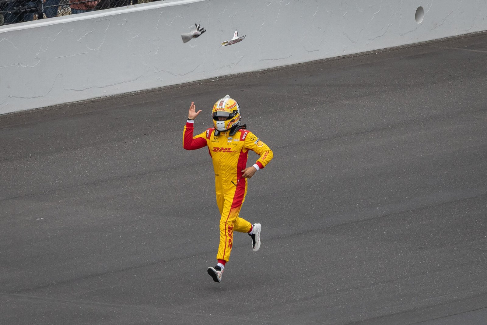 Alex Palou Throws His Gloves In Air While Running Toward Team After 2025 Indy 500 Victory