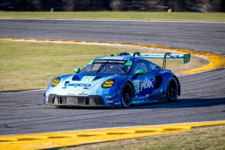 120 Wright Motorsports Porsche Exiting the International Horseshoe at Daytona International Speedway - 2024 120 Wright Motorsports Porsche Exiting International Horseshoe A