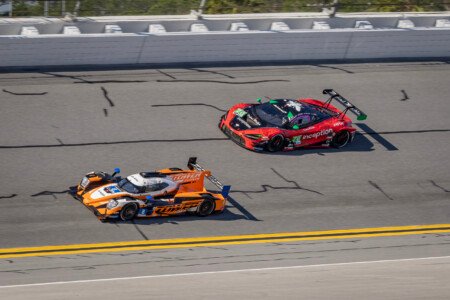8 Tower Motorsports Oreca and 70 Inception Racing McLaren in Turn 1 at Daytona International Speedway - 2024 8 Tower Motorsports Oreca And 70 Inception Racing Mclaren In Tur