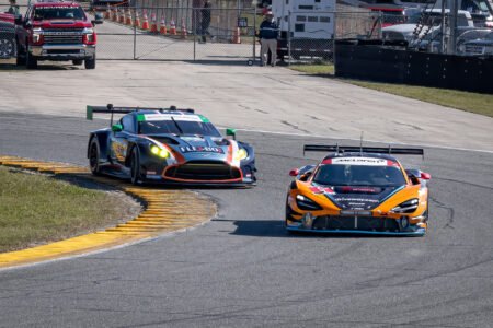 9 Pfaff Motorsports McLaren and 44 Magnus Racing Aston Martin through the West Horseshoe at Daytona International Speedway - 2024